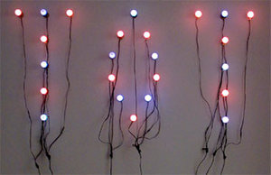 Christian Boltanski, "Tot", 2001, light installation of 24 bulbs. Via designboom.com.